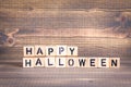 Happy halloween. Wooden letters on the office desk