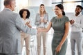 Happy handshake, by man and woman in office, for promotion in business, team gives applause. Meeting with diversity in Royalty Free Stock Photo