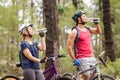 Happy handsome biker couple drinking water Royalty Free Stock Photo