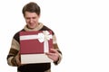 Happy handsome Caucasian man opening gift box ready for Valentin Royalty Free Stock Photo