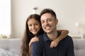 Happy handsome dad and cheerful girl looking at camera Royalty Free Stock Photo