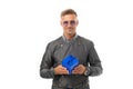 Happy handsome guy in casual trenchcoat hold blue gift box isolated on white, present