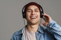 Happy handsome guy listening music with headphones Royalty Free Stock Photo