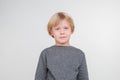 Happy handsome little boy posing in the studio. Royalty Free Stock Photo