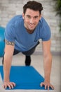 happy handsome man doing push ups at home Royalty Free Stock Photo