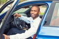 Happy handsome man in his new blue car Royalty Free Stock Photo