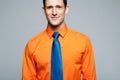 Happy handsome man in orange shirt.