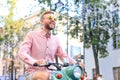 Happy handsome man riding on scooter in the city Royalty Free Stock Photo