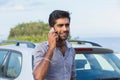 Happy handsome man young entrepreneur talking on mobile phone standing by his new car Royalty Free Stock Photo