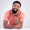 Happy, handsome and portrait of a black man leaning on a table isolated on a white background. Smile, relax and an Royalty Free Stock Photo