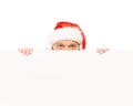 Happy and handsome teenage guy in a Christmas hat and a banner Royalty Free Stock Photo
