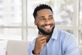 Happy handsome young African American business man looking away Royalty Free Stock Photo