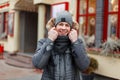 Happy handsome young man with a smile in a winter fashion jacket Royalty Free Stock Photo