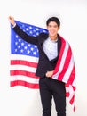 Happy handsome young man with standing hands hold American flag Royalty Free Stock Photo