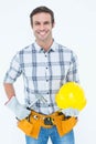 Happy handyman holding hammer and hard hat Royalty Free Stock Photo