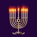 Hanukkah menorah, Gold chanukiah or hanukkiah, nine-branched candelabrum lit during the eight-day holiday of Chanukkah festival Royalty Free Stock Photo