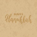 Happy Hanukkah - hand drawn lettering phrase on the cardboard grunge background. Fun brush ink inscription for