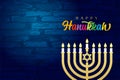 Happy Hanukkah lettering and menorah on brick wall Royalty Free Stock Photo