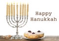 Happy Hanukkah. Silver menorah, sufganiyot and dreidels on wooden table Royalty Free Stock Photo