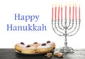 Happy Hanukkah. Silver menorah, sufganiyot and dreidels on wooden table Royalty Free Stock Photo