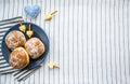 Happy Hanukkah. A traditional treat of doughnuts with David star and dreidel made from cheese and biscuit sticks. Blue fabric