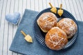 Happy Hanukkah. A traditional treat of doughnuts with David star and dreidel made from cheese and biscuit sticks. Blue fabric