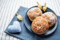 Happy Hanukkah. A traditional treat of doughnuts with David star and dreidel made from cheese and biscuit sticks. Blue fabric