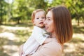 Happy harmonious family outdoors. mother with her baby, playing in the summer on the nature Royalty Free Stock Photo