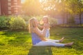 Happy harmonious family outdoors. mother laughing and playing with baby daughter girl in the summer on the nature Royalty Free Stock Photo