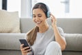 Happy, headphones and phone with woman at home with remote work, music and living room with smile. Podcast, tech and Royalty Free Stock Photo