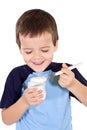 Happy healthy boy eating yogurt Royalty Free Stock Photo