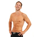 Happy,healthy and confident. Studio portrait of a handsome young man posing shirtless against a white background. Royalty Free Stock Photo