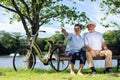 Happy and healthy couple Asian sitting chair beside a bicycle Family and friendship lifestyle, Enjoyment of active seniors, and