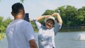 Happy and healthy couples Asian photo and VLOG selfie together for social media in park on leisure. Family and friendship