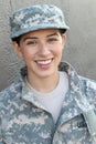 Happy healthy ethnic army female soldier smiling and laughing showing pride and joy Royalty Free Stock Photo