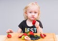 Happy kid  eating fresh strawberries Royalty Free Stock Photo