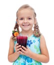 Happy healthy little girl with fresh juice