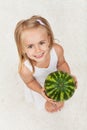 Happy healthy little girl holding a watermelon - looking up Royalty Free Stock Photo