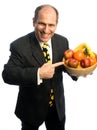 Happy healthy man with bowl of fruit Royalty Free Stock Photo