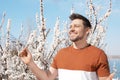 Happy healthy man enjoying springtime outdoors