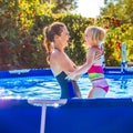 Happy healthy mother and child in swimming pool playing Royalty Free Stock Photo