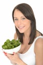 Happy Healthy Natural Attractive Young Woman Holding a Bowl of Fresh Raw Spinach