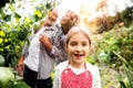 Senior couple with grandaughter gardening in the backyard garden Royalty Free Stock Photo