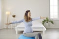 Happy healthy young woman doing gymnastic exercises with a yoga ball during pregnancy Royalty Free Stock Photo