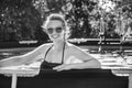 Happy healthy woman in swimming pool in sunglasses Royalty Free Stock Photo