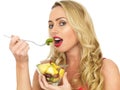 Happy Healthy Young Woman Eating Fresh Fruit Salad Royalty Free Stock Photo