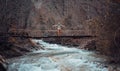 Happy hiker on bridge