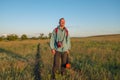 Happy hiker stands in the prairie