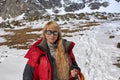 Happy hiker walking in the mountains, freedom and happiness, achievement in mountains. Royalty Free Stock Photo