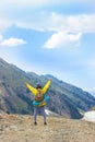 Happy hiker winning reaching life goal, success, freedom and happiness, achievement in mountains Royalty Free Stock Photo